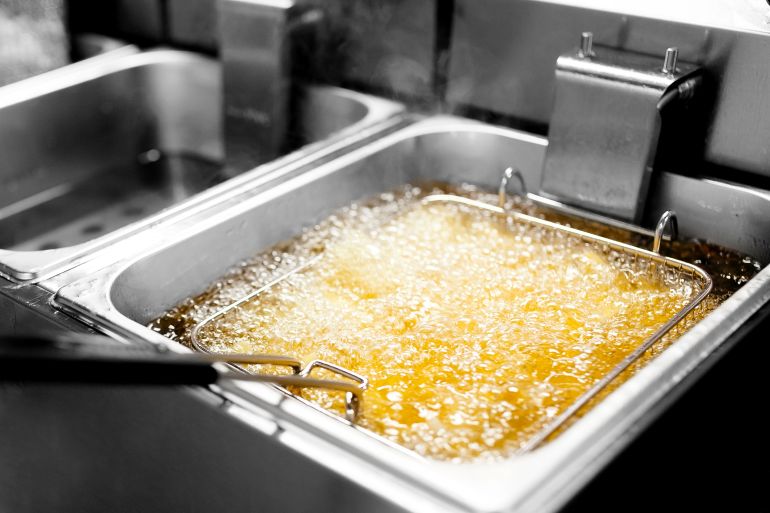 Fryer with French fries, close-up. The oil boils; Shutterstock ID 748828117; purchase_order: ajanet; job: ; client: ; other: